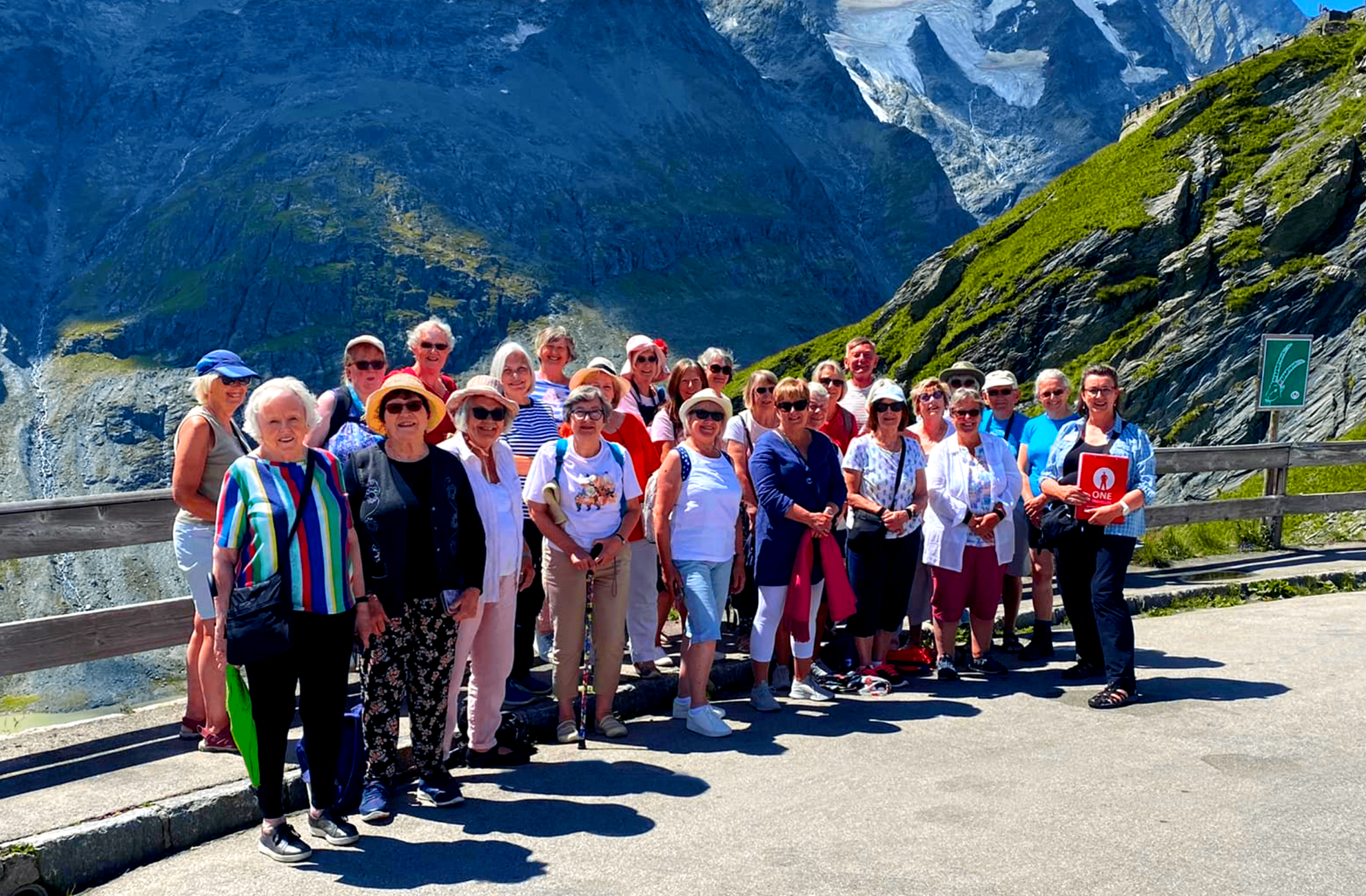 Photo of a One Traveller Group In front of Mountains
